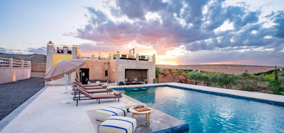 Luxury Moroccan riad with private pool and sunset views in Marrakech. Experience authentic Moroccan style and serene outdoor relaxation near the desert. Perfect for a luxurious getaway.