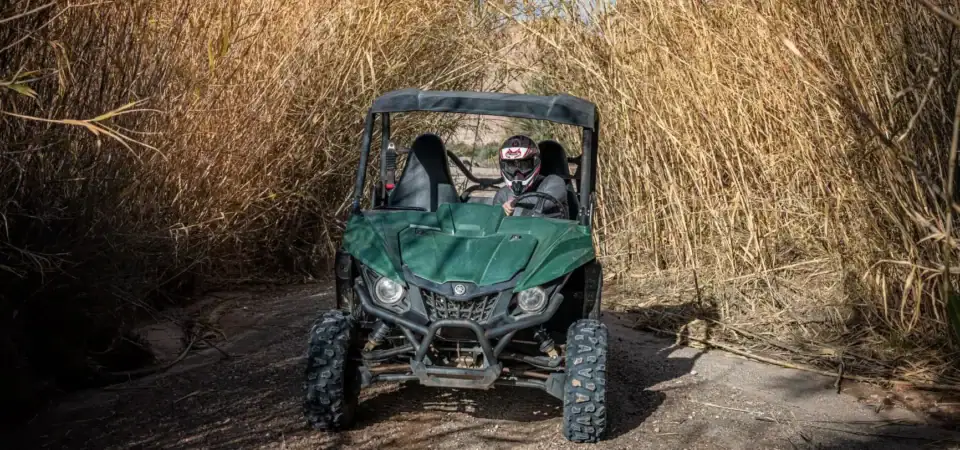 Adventure off-road ATV ride through desert scrub in Marrakech, Morocco for outdoor sports and thrill-seeking experiences.